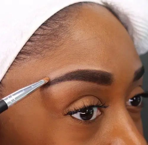 Highlight eyebrows with concealer